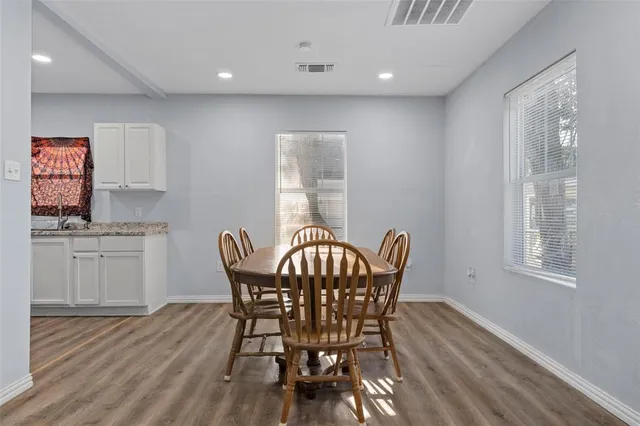 a dining room with furniture and window