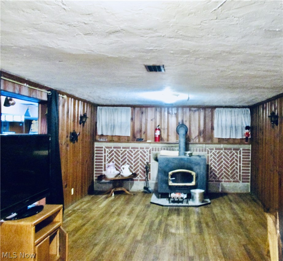 6411 Snow Road Parma, OH 44129 - Photo 10 of 14 Large recreation room in the basement with wood burning stove