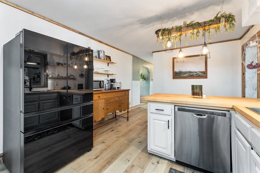 1653 Lester Flatt Road Sparta, TN 38583 - Photo 11 of 59 a kitchen with a sink stove and cabinets