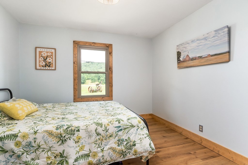 1653 Lester Flatt Road Sparta, TN 38583 - Photo 17 of 59 a bedroom with a bed and a window