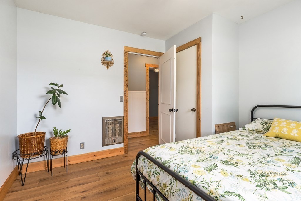 1653 Lester Flatt Road Sparta, TN 38583 - Photo 18 of 59 a bedroom with a bed and a table in it