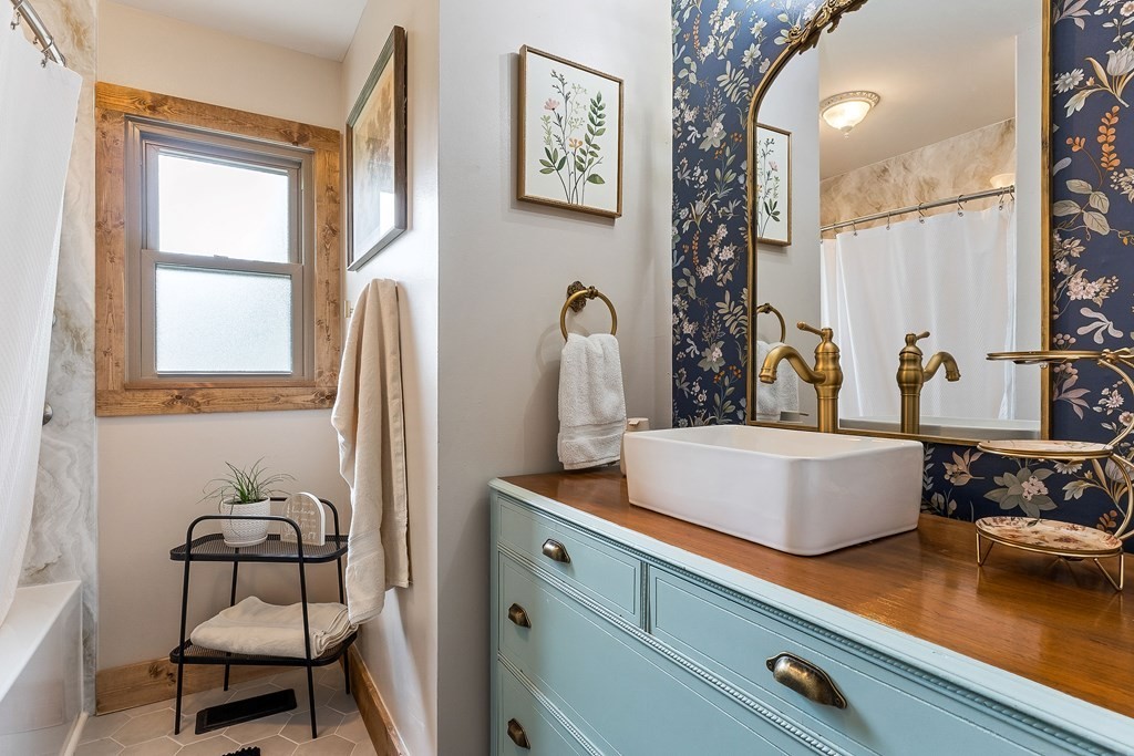 1653 Lester Flatt Road Sparta, TN 38583 - Photo 19 of 59 a bathroom with a sink and a mirror