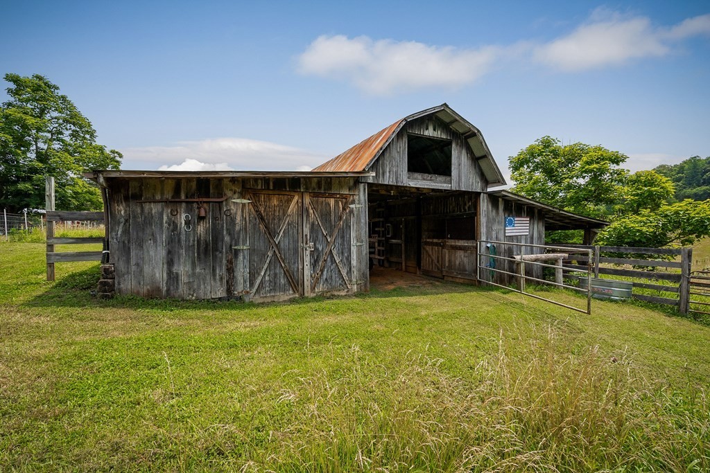 1653 Lester Flatt Road Sparta, TN 38583 - Photo 37 of 59 a view of a kitchen with a sink and a yard