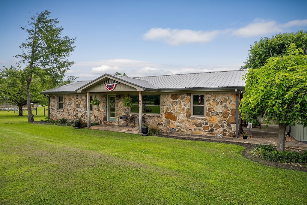 1653 Lester Flatt Road Sparta, TN 38583 - Photo 45 of 59 a front view of a house with garden