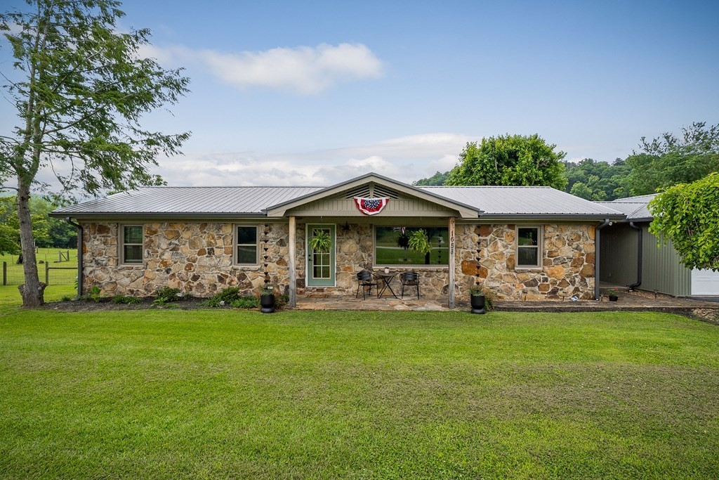 1653 Lester Flatt Road Sparta, TN 38583 - Photo 46 of 59 a front view of a house with a garden
