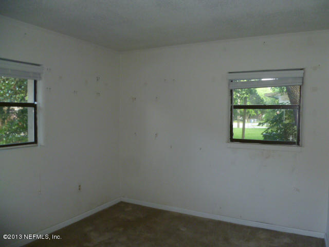 1722 Cortez Road Jacksonville, FL 32246 - Photo 9 of 10 an empty room with windows