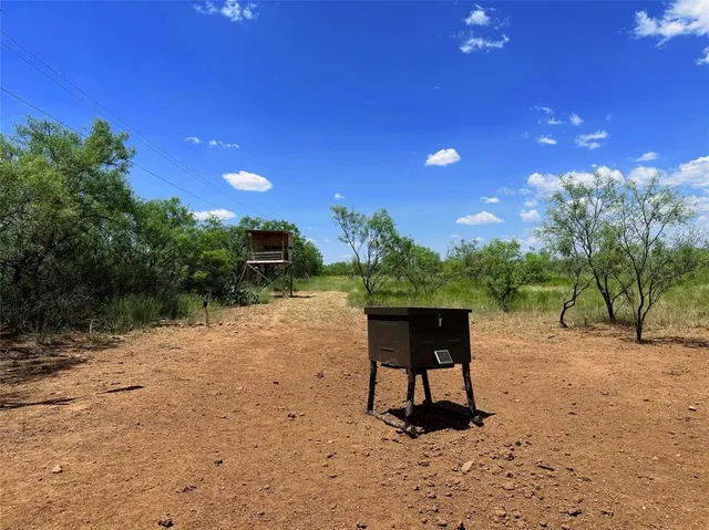 a view of a entrance gate of the house and lake view
