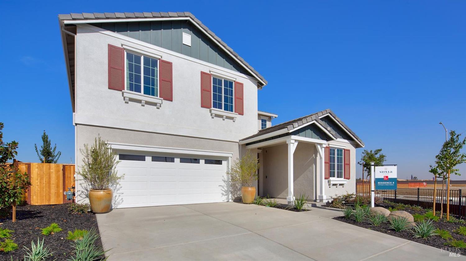 a front view of a house with a garage