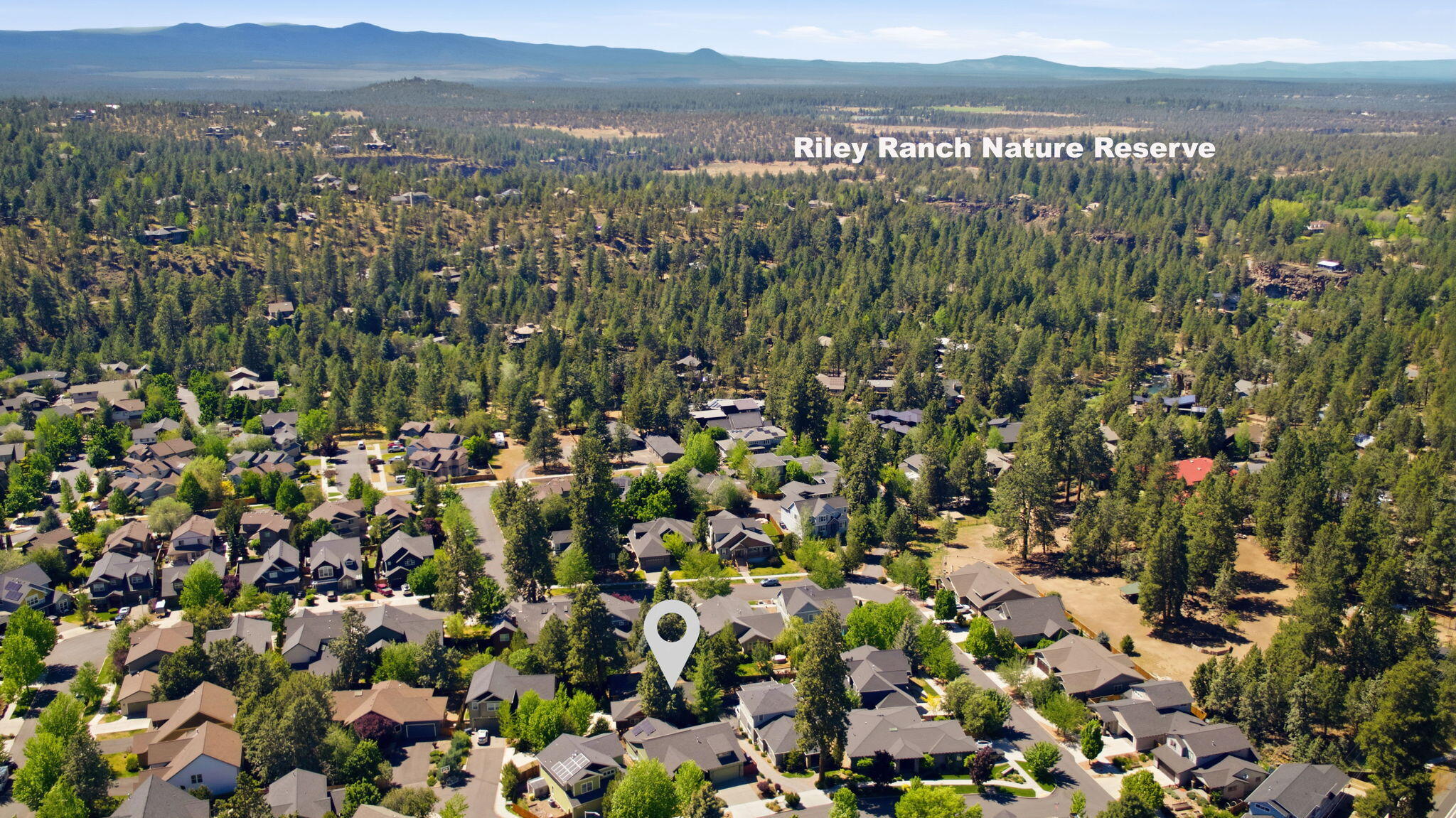 62944 Fresca Street Bend, OR 97703 - Photo 31 of 32 a view of a city with green field