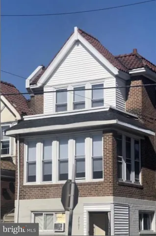 a front view of a house with glass windows