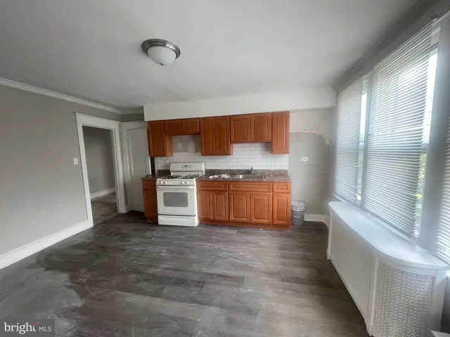 a kitchen with stainless steel appliances a refrigerator and a sink