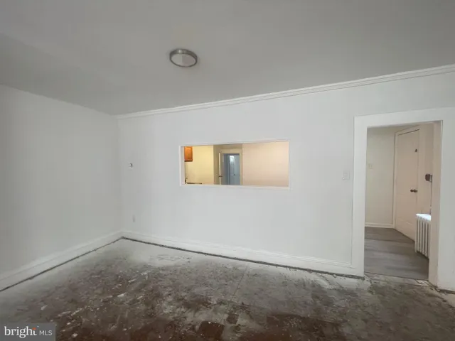 a kitchen with granite countertop sink stove and cabinets