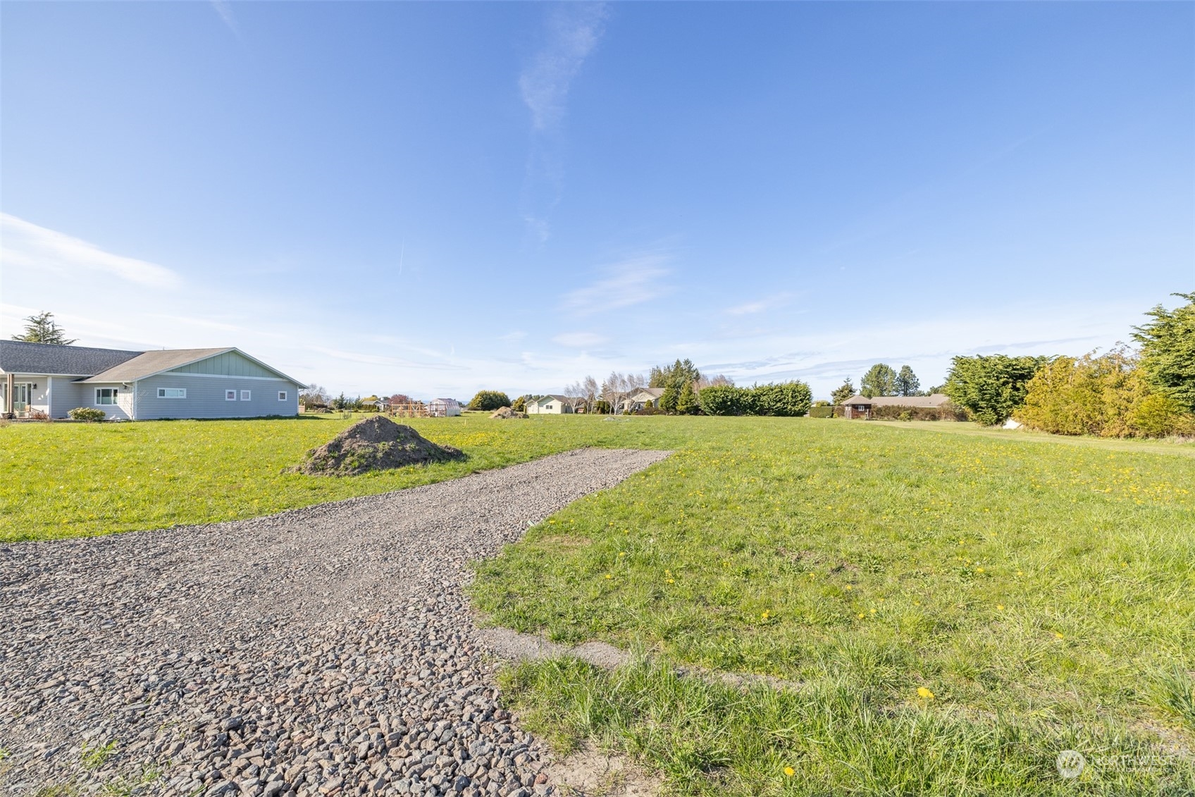 52 Tulip Lane Sequim, WA 98382 - Photo 6 of 40 a view of a lake from a yard