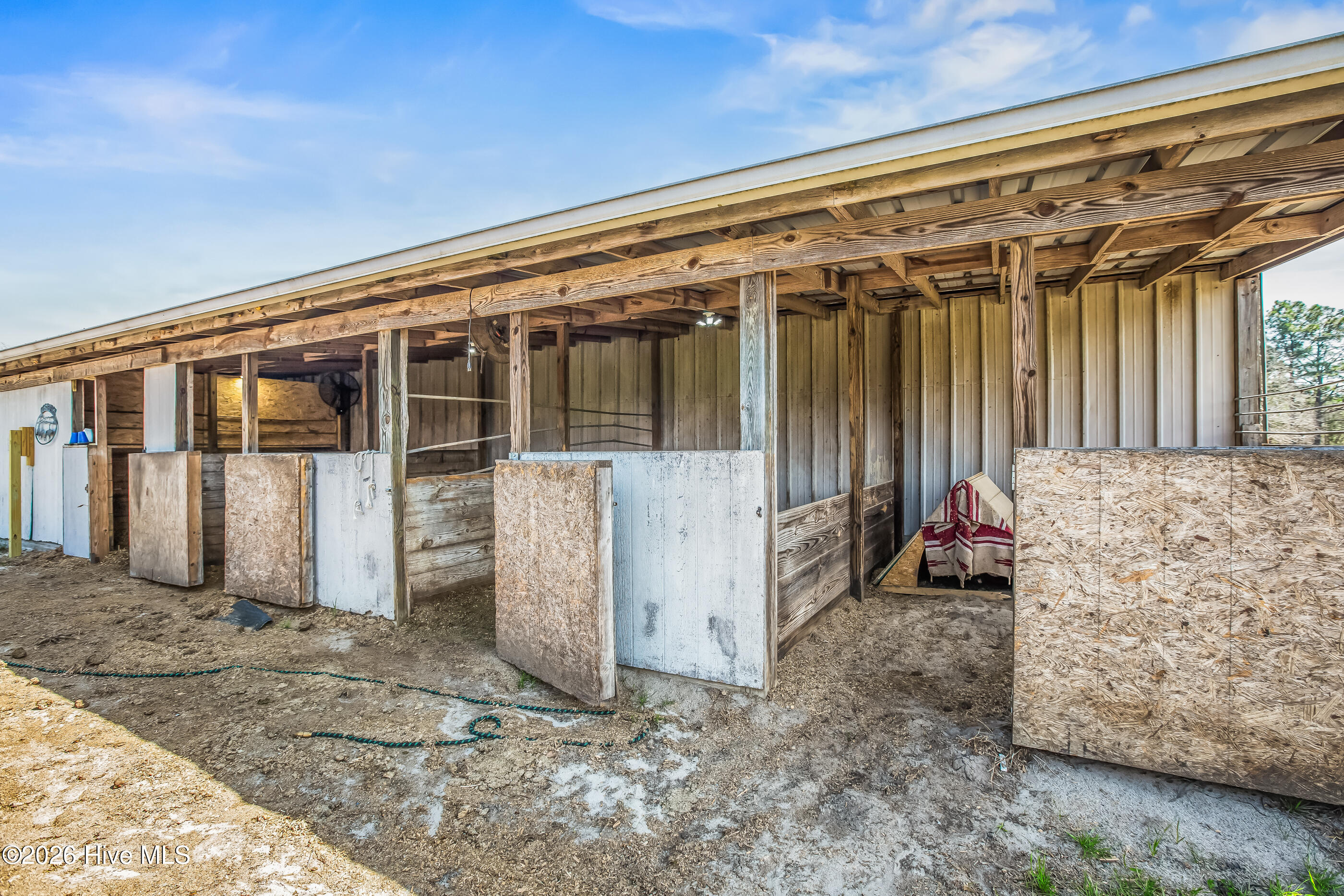 526 Springhill Church Road Hamlet, NC 28345 - Photo 55 of 82 3/4 outside stalls attached to barn/arena