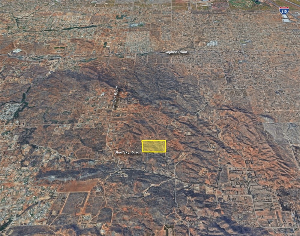 2 Blue Sky Road Perris, CA 92570 - Photo 2 of 6 a building with a yard