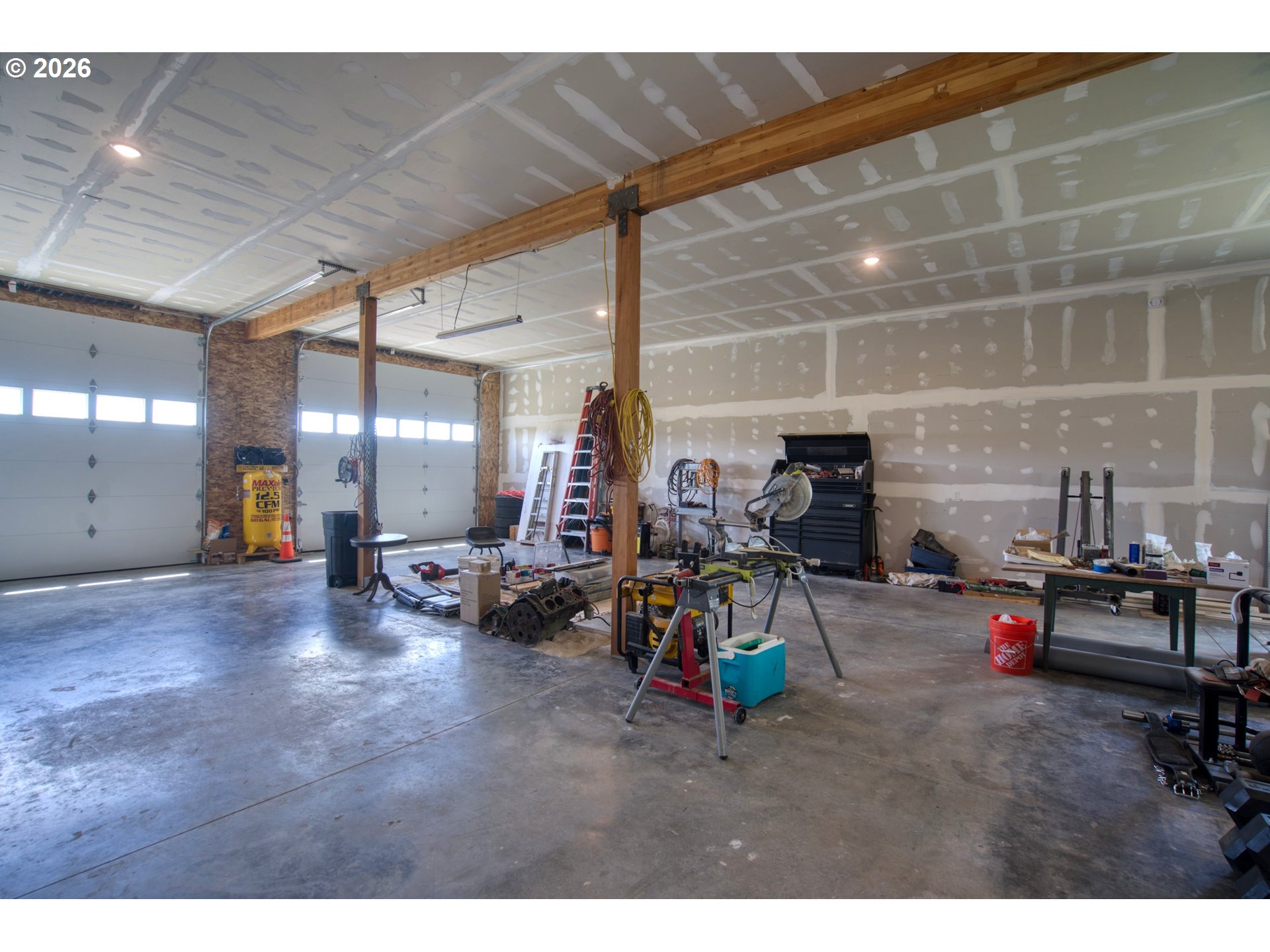 19 Inverness Road Goldendale, WA 98620 - Photo 41 of 48 a view of a garage with a bike and car