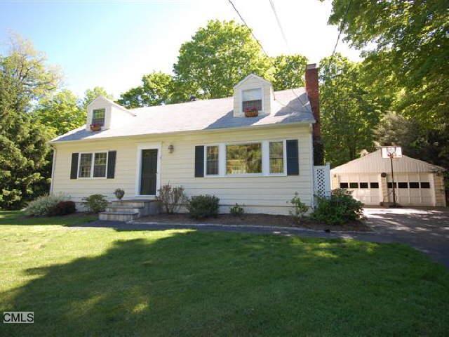 299 Old Stagecoach Road Ridgefield, CT 06877 - Photo 1 of 1 a front view of house with yard and green space