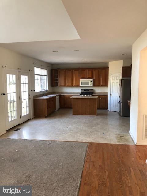 745 Blossom Tree Road Culpeper, VA 22701 - Photo 3 of 3 a large kitchen with kitchen island a sink stainless steel appliances and cabinets
