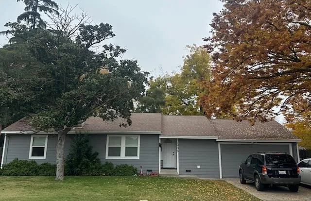 a view of a house with a cars park