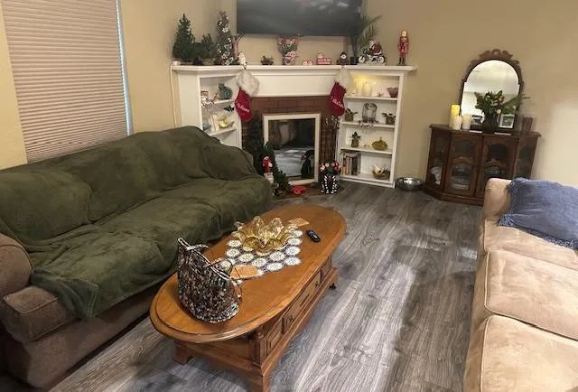 a living room with furniture and a fireplace