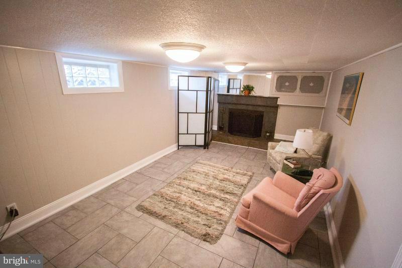 701 Grantwood Road Baltimore, MD 21220 - Photo 25 of 30 Finished Lower Level With Fireplace