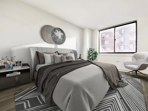 a bedroom with a bed and window
