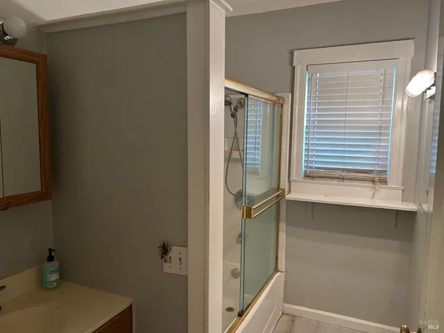 a bathroom with a sink and a mirror