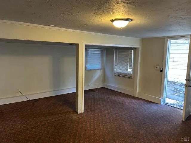 an empty room with closet area
