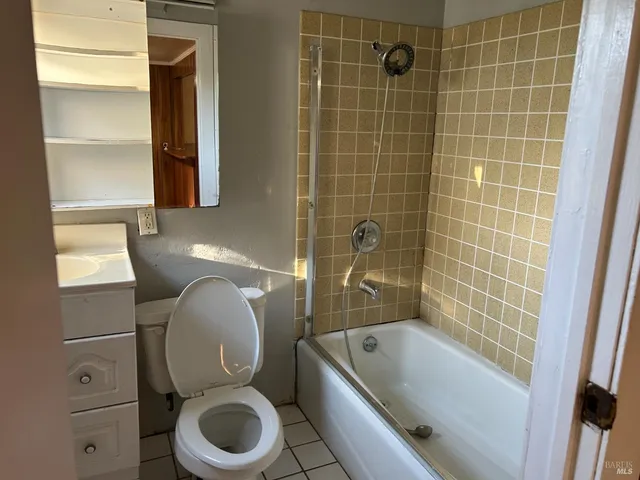 a bathroom with a toilet and a bathtub