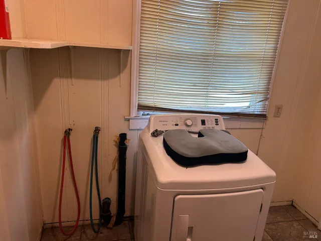 a bathroom with a sink and a washer
