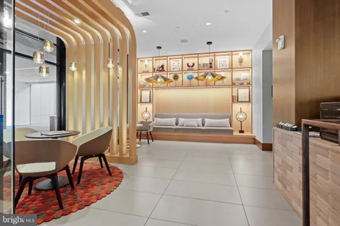 a lobby with furniture and outdoor view