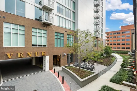 a view of a building and car parked