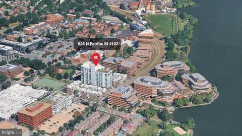 an aerial view of a house with outdoor space