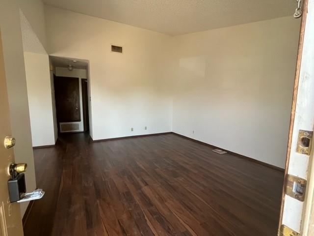 11308 Ptarmigan Drive, Unit B Austin, TX 78758 - Photo 2 of 6 wooden floor in an empty room