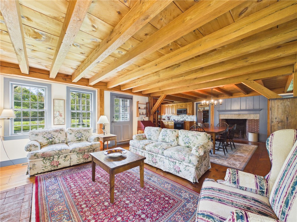 307 Stony Fort Road Saunderstown, RI 02874 - Photo 17 of 48 Two fireplaces flank this family room and dining room