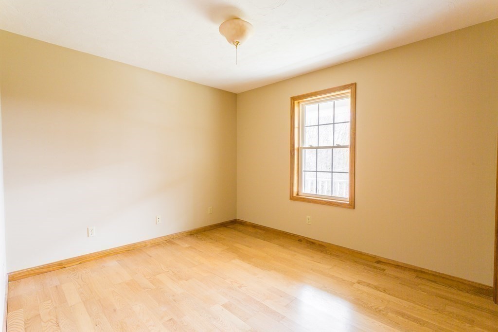 147 Ragged Hill Road West Brookfield, MA 01585 - Photo 20 of 42 a view of an empty room with wooden floor and a window