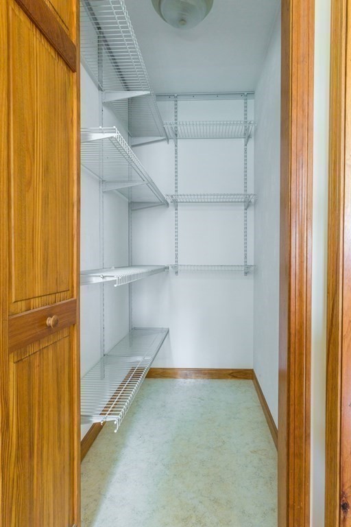 147 Ragged Hill Road West Brookfield, MA 01585 - Photo 22 of 42 a view of walk in closet with empty racks