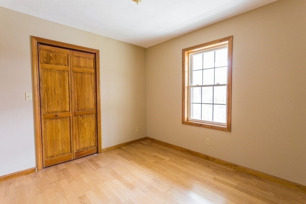 147 Ragged Hill Road West Brookfield, MA 01585 - Photo 23 of 42 an empty room with windows