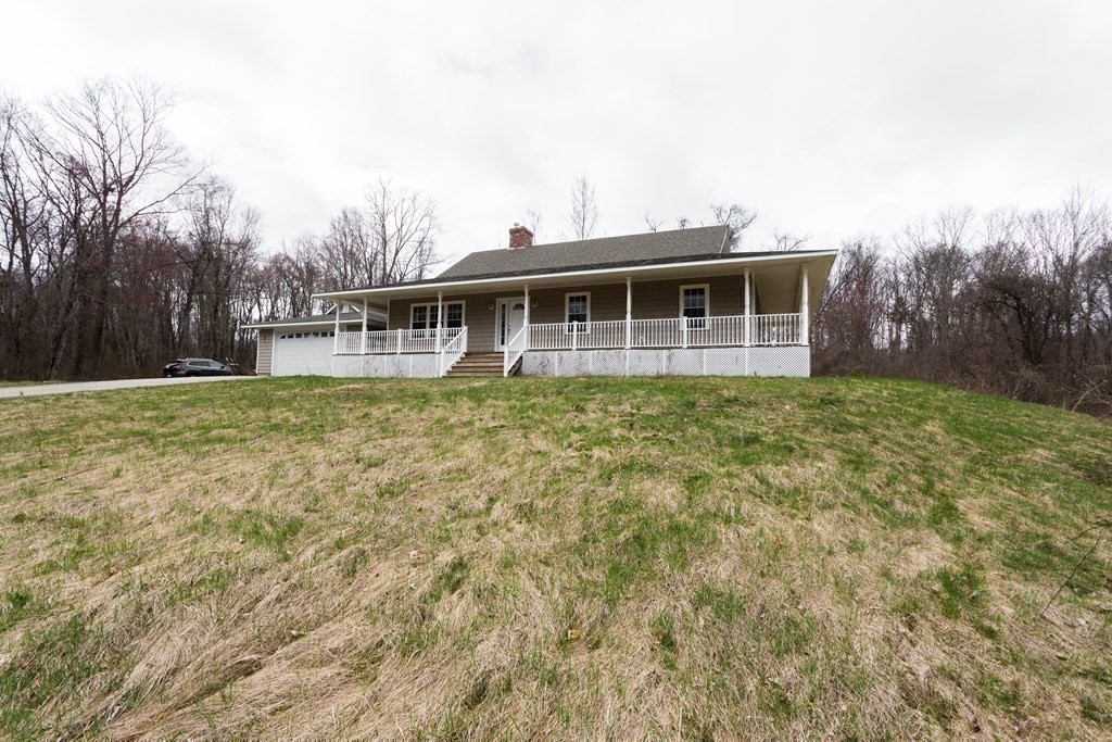 147 Ragged Hill Road West Brookfield, MA 01585 - Photo 26 of 42 a view of a house with a yard
