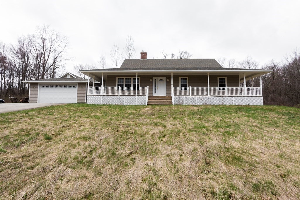 147 Ragged Hill Road West Brookfield, MA 01585 - Photo 3 of 42 a front view of a house with a yard