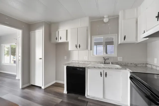 a kitchen with a sink and cabinets