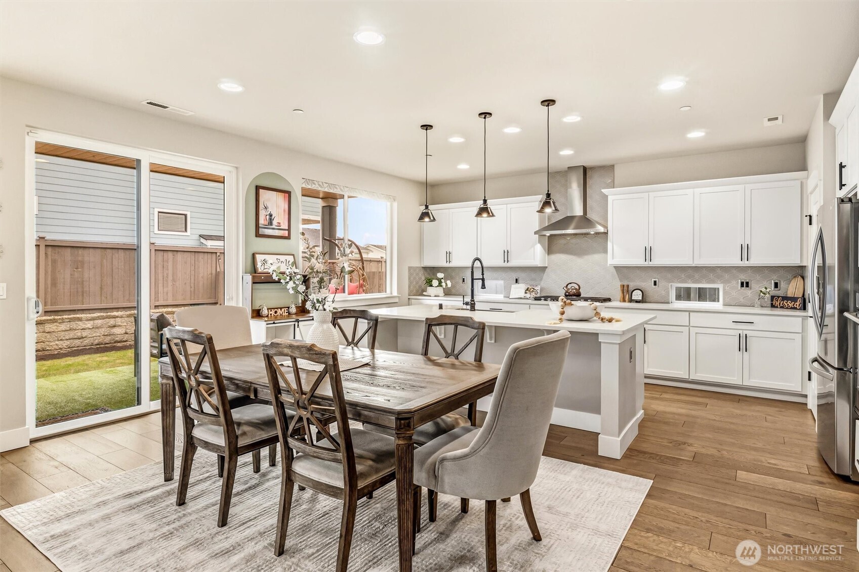 4418 242nd Place Southeast Bothell, WA 98021 - Photo 11 of 40 a large kitchen with a table and chairs