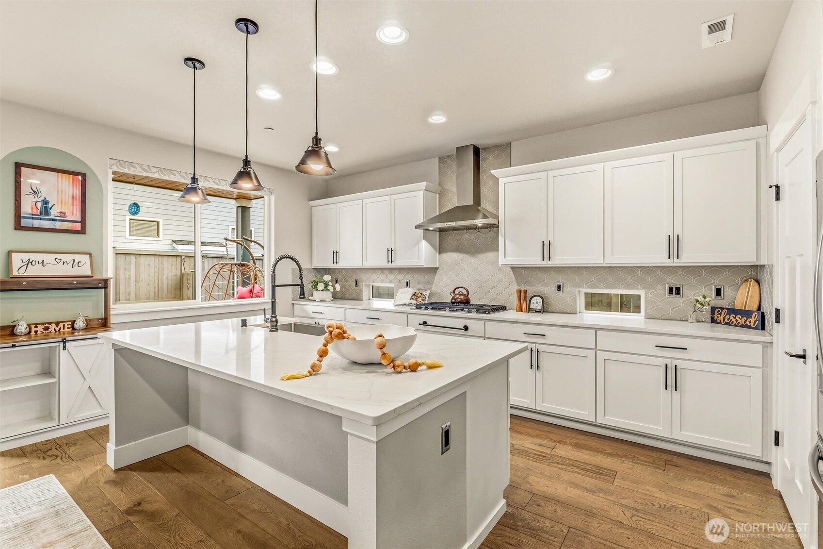 4418 242nd Place Southeast Bothell, WA 98021 - Photo 12 of 40 a kitchen with a sink stove and cabinets