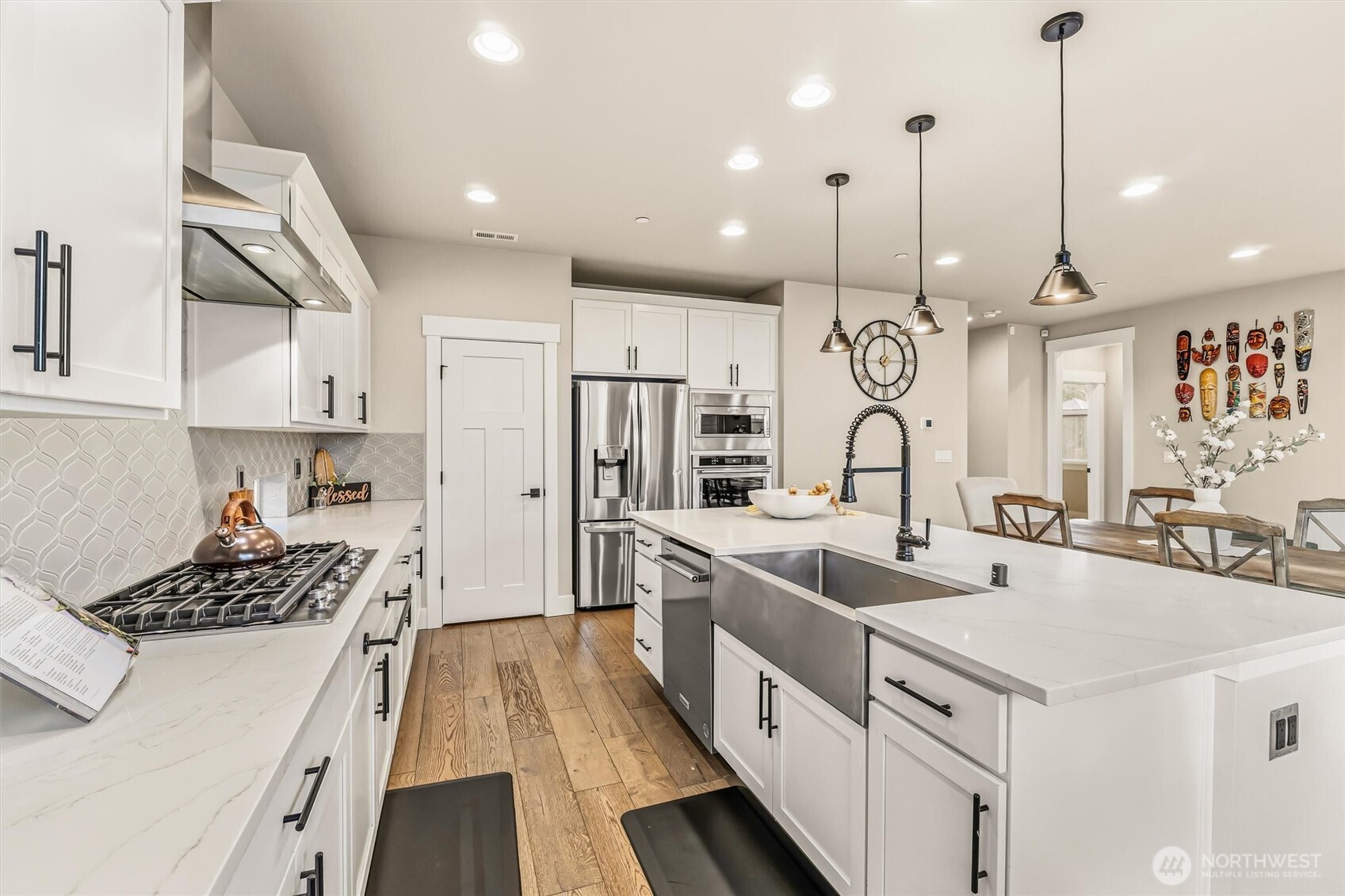 4418 242nd Place Southeast Bothell, WA 98021 - Photo 14 of 40 a large kitchen with stainless steel appliances kitchen island a large stove a sink a oven and a center island