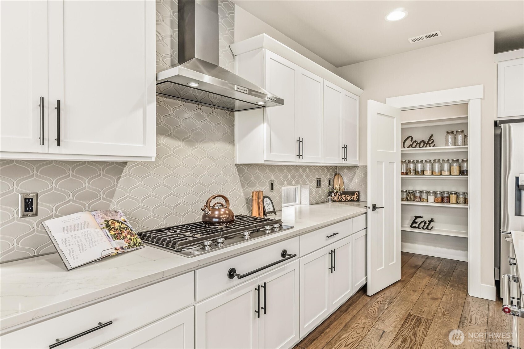 4418 242nd Place Southeast Bothell, WA 98021 - Photo 15 of 40 a kitchen with white cabinets and appliances