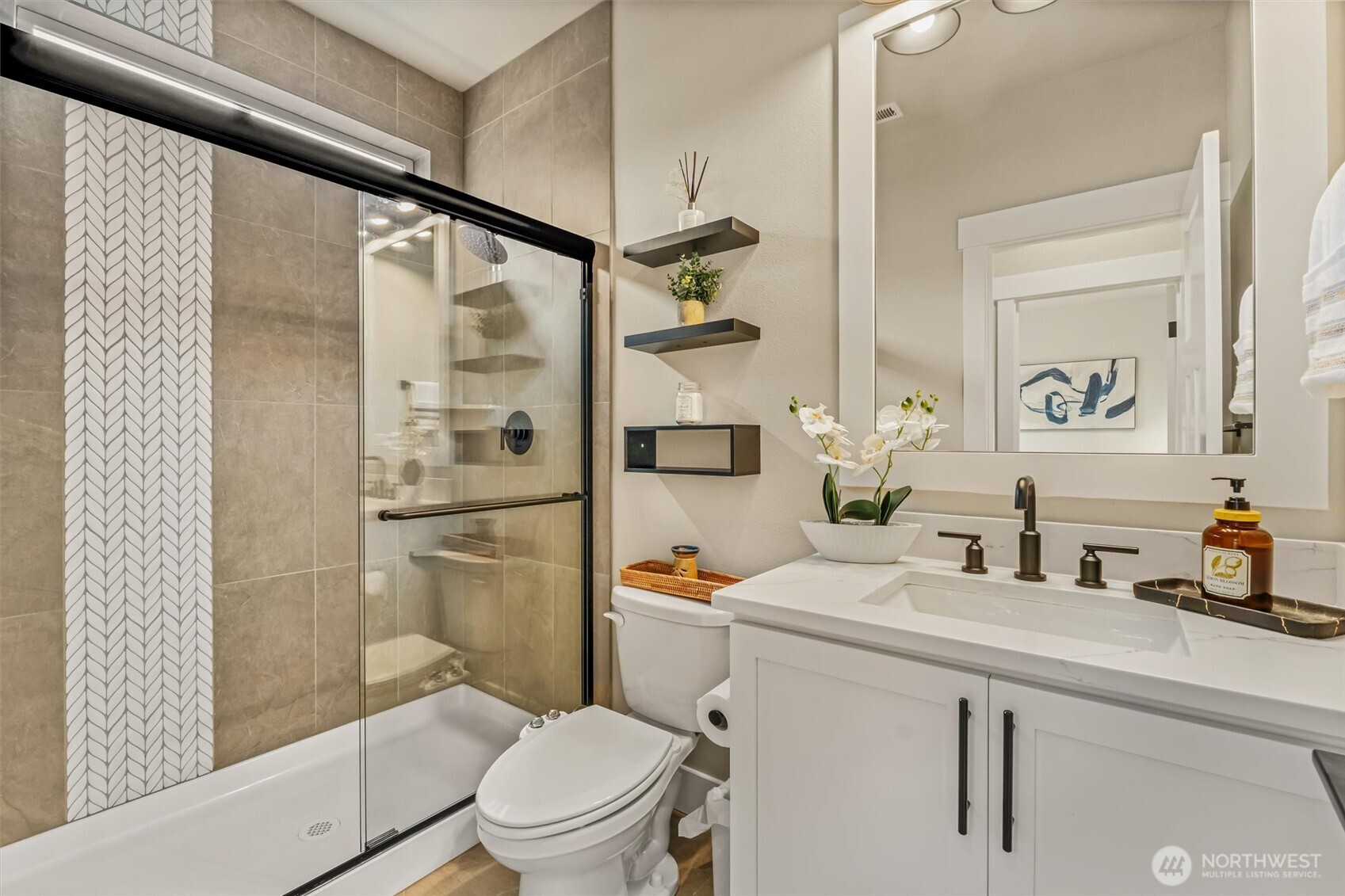 4418 242nd Place Southeast Bothell, WA 98021 - Photo 17 of 40 a bathroom with a shower a sink a toilet and shower