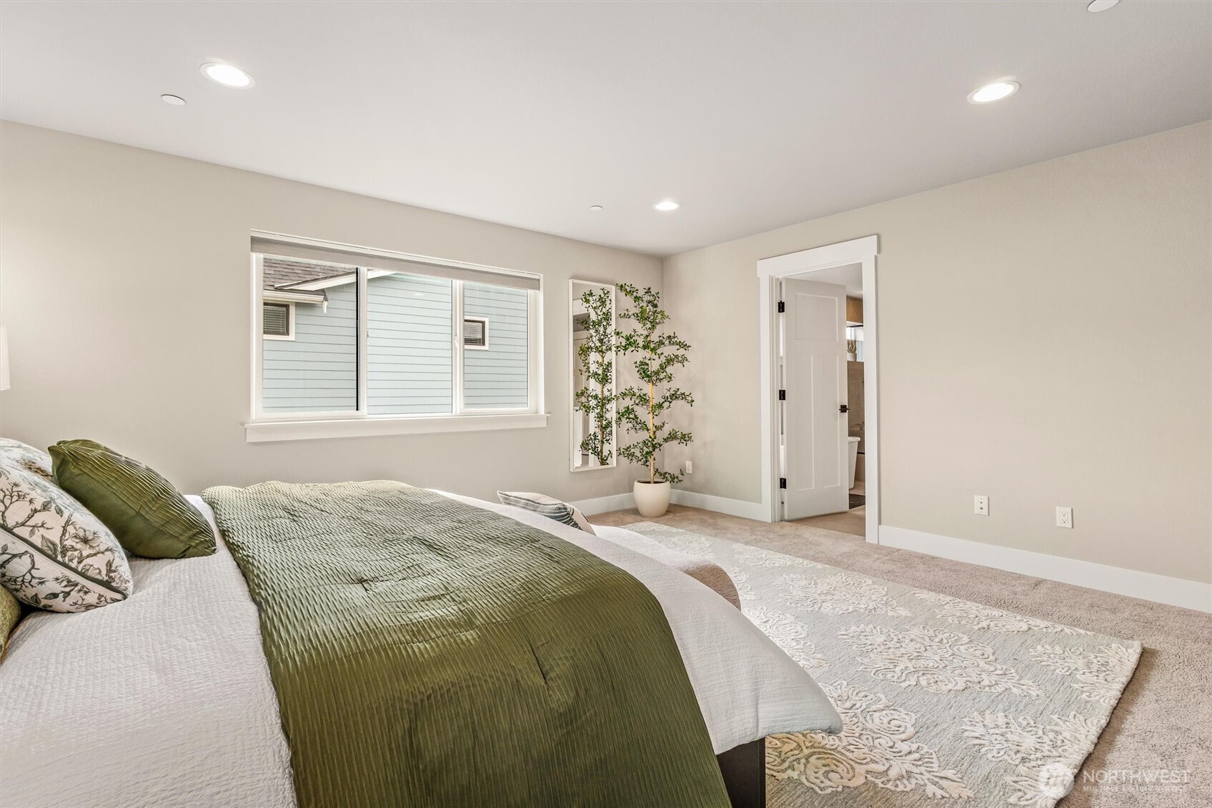 4418 242nd Place Southeast Bothell, WA 98021 - Photo 23 of 40 a spacious bedroom with a bed and a window