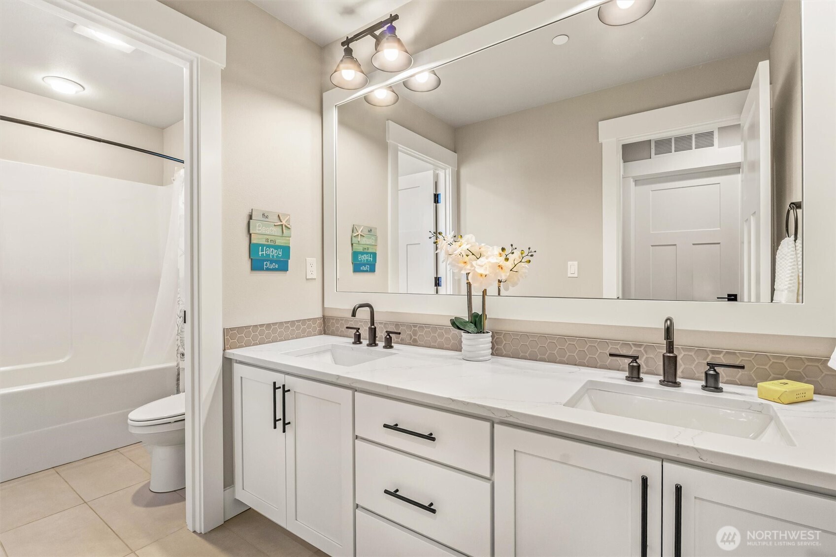 4418 242nd Place Southeast Bothell, WA 98021 - Photo 28 of 40 a bathroom with a granite countertop sink mirror vanity bathtub and a toilet