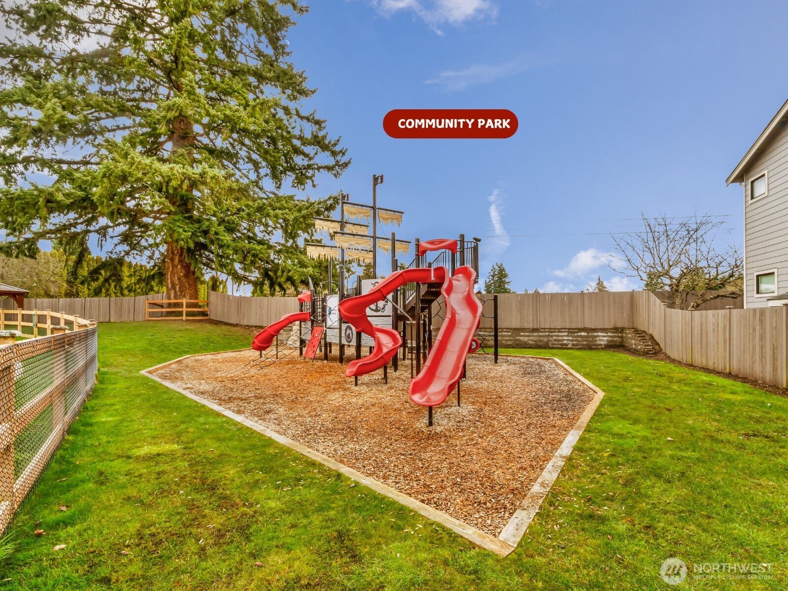 4418 242nd Place Southeast Bothell, WA 98021 - Photo 38 of 40 a view of a park with swings and slides