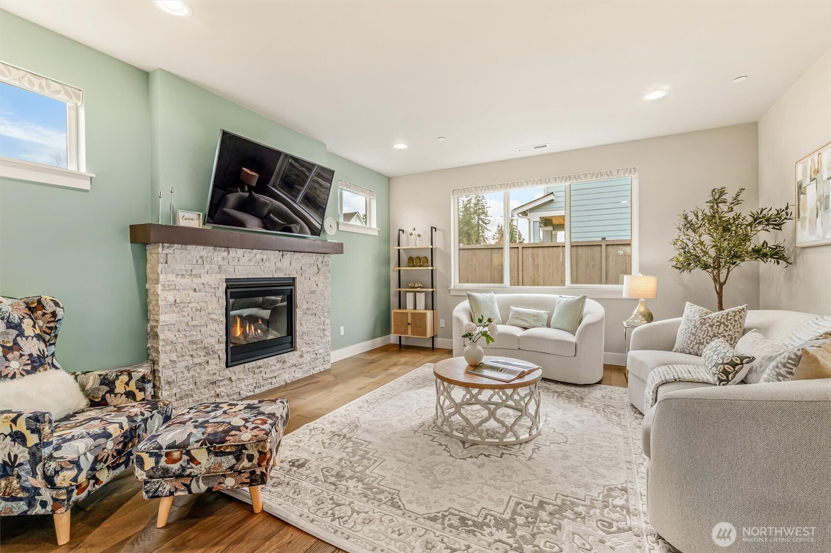 4418 242nd Place Southeast Bothell, WA 98021 - Photo 7 of 40 a living room with furniture and a fireplace